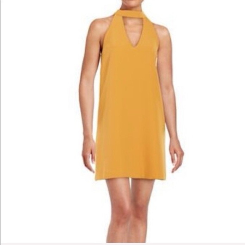 Lulus Groove Thing golden yellow swing dress with a mock neck and front cutout